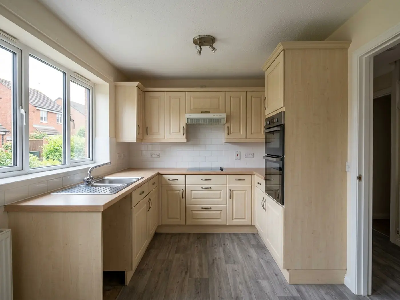 Cleared kitchen worktops ready for spraying week