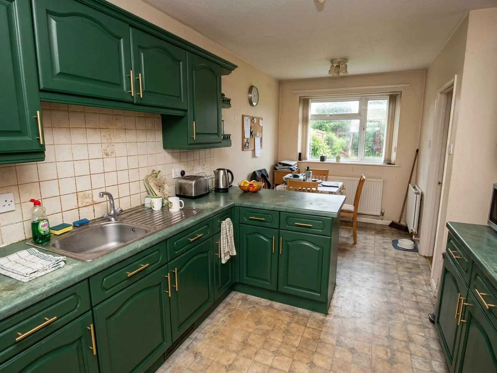 The same kitchen after the cabinets were resprayed