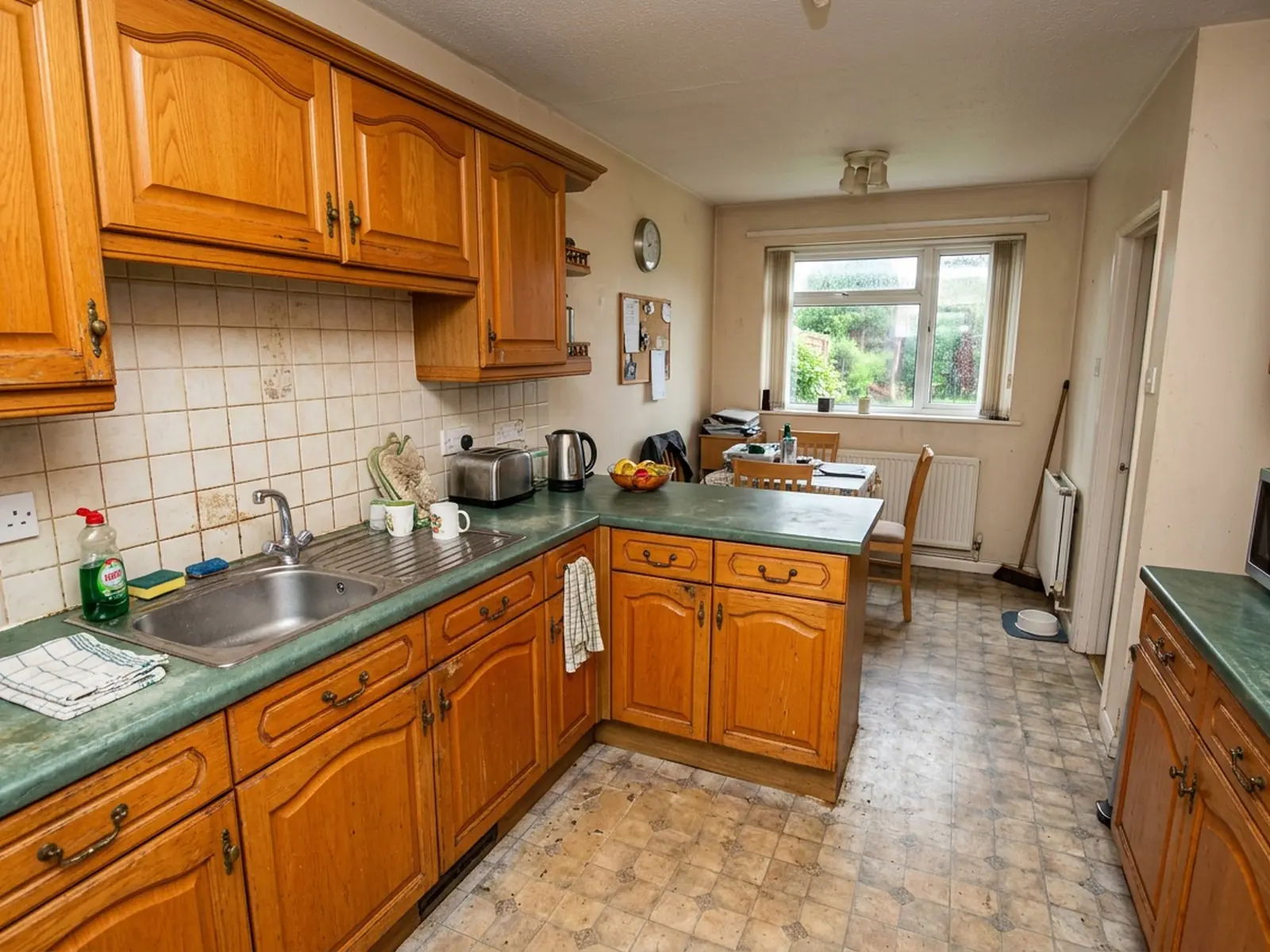 Dated kitchen cabinets before respraying in Nantwich
